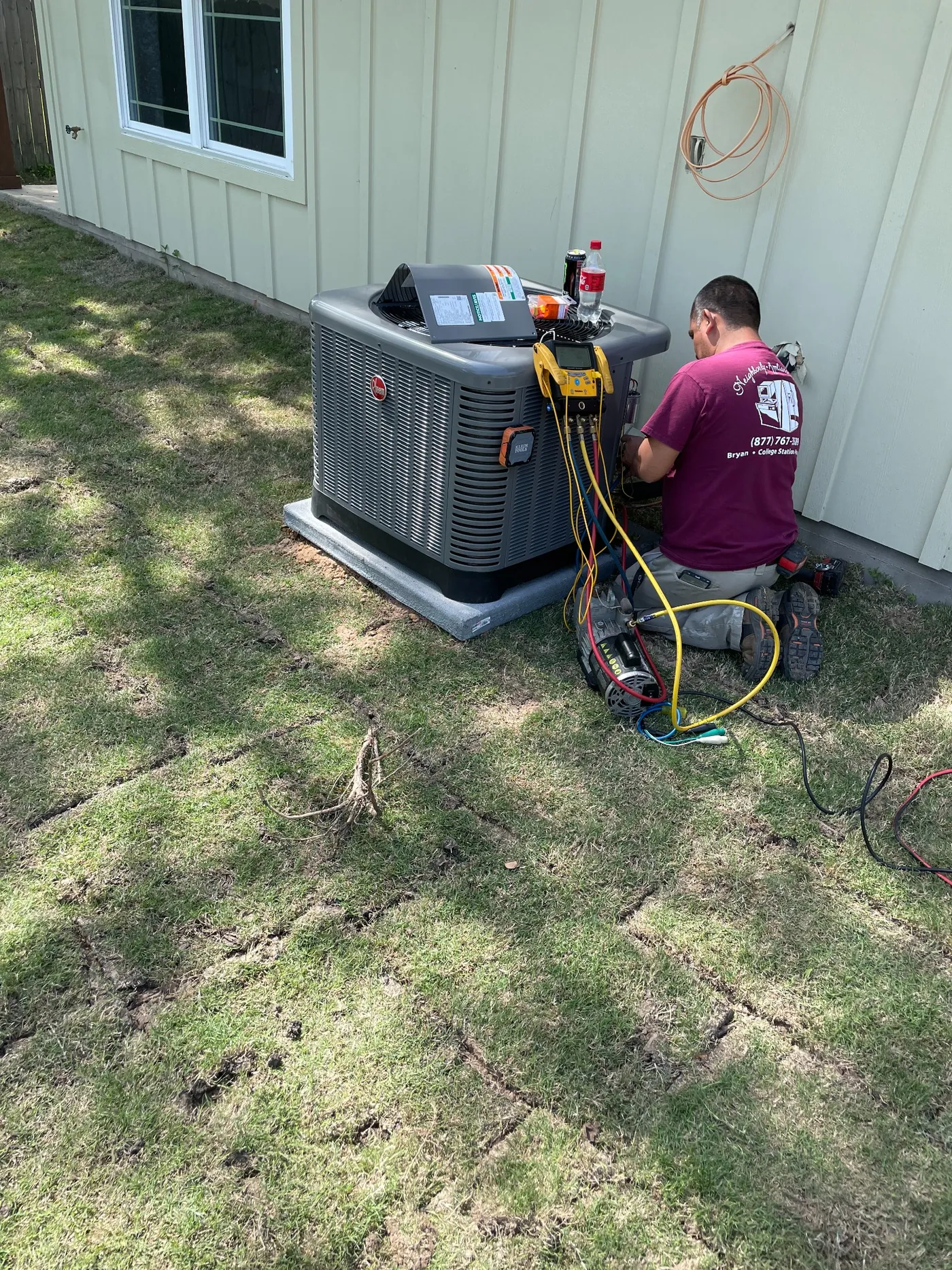 Neighborly technician servicing an AC system
